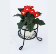 Pot of Red Gebera Daisies in a Black Wire Plant Stand
